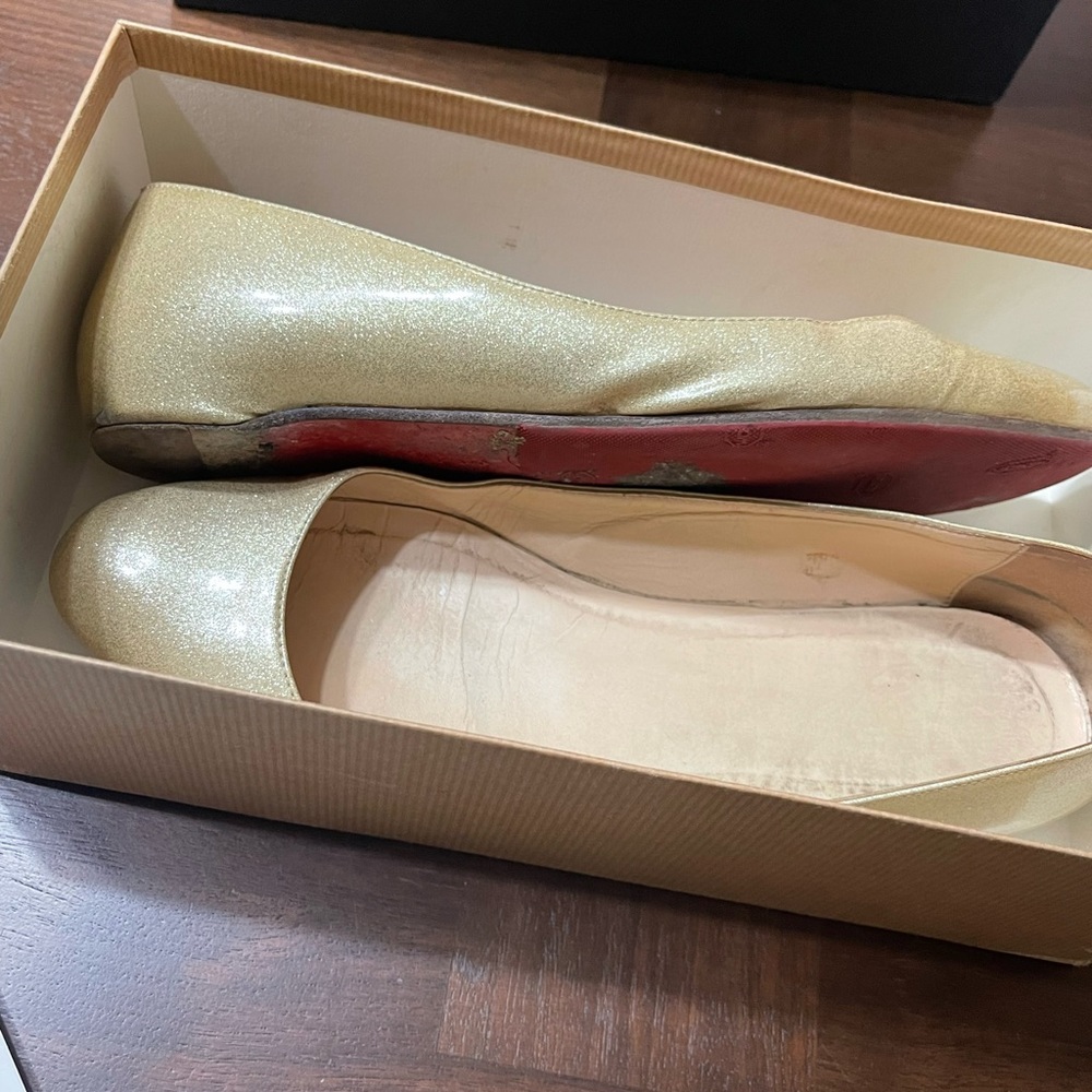 Well loved Christian Louboutin flats